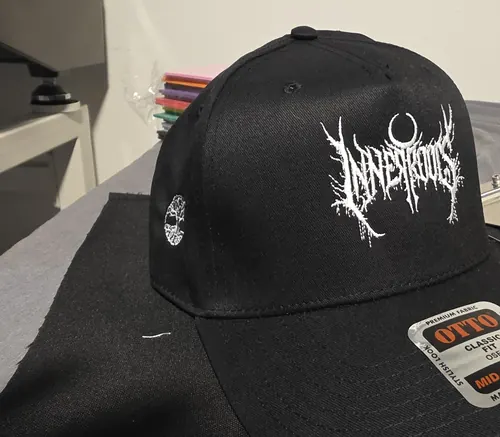 Black Otto mid-profile cap with the white Inner Roots logo