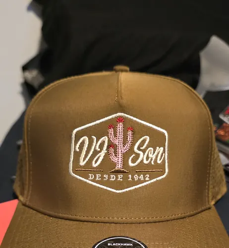 Tan cap with the white VJ Son Desde 1942 hexagon badge and a pink and green cactus